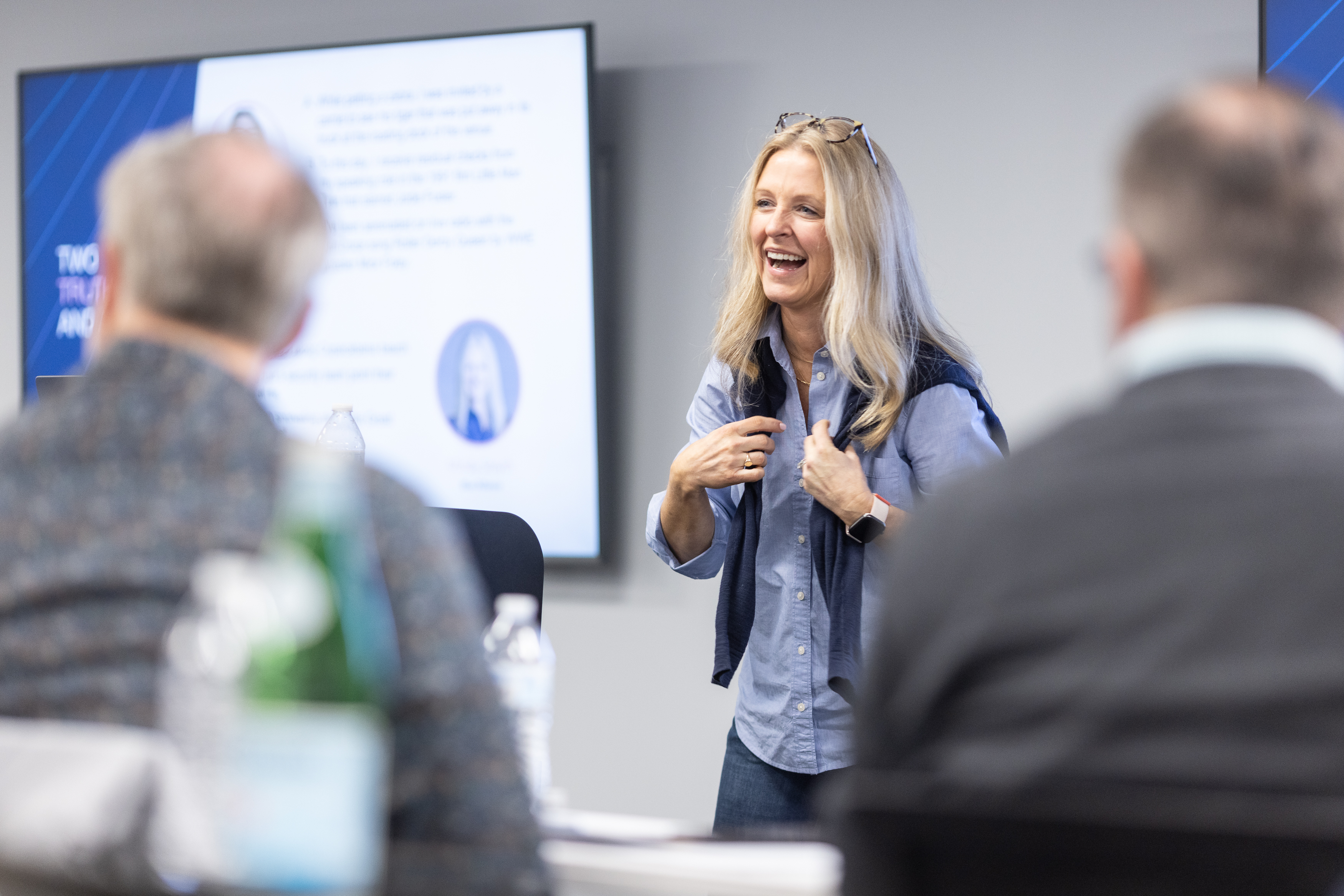Mindy Smyth presenting to a leadership team at a corporate summit